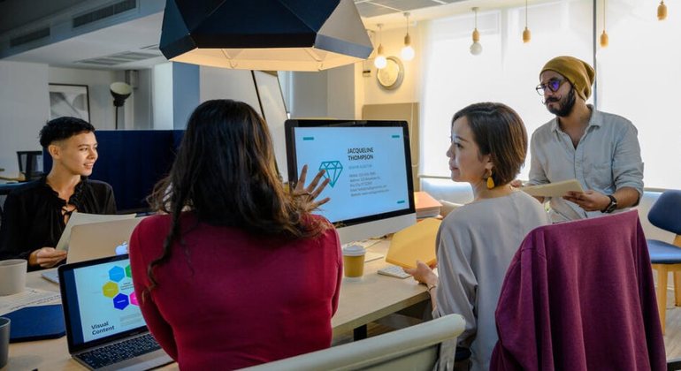 Team reviewing dashboards together in a conference room.